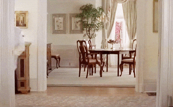 Elegant dining room with formal wood table set for a portioned meal