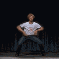 Man energetically dancing on a dark stage to stay active