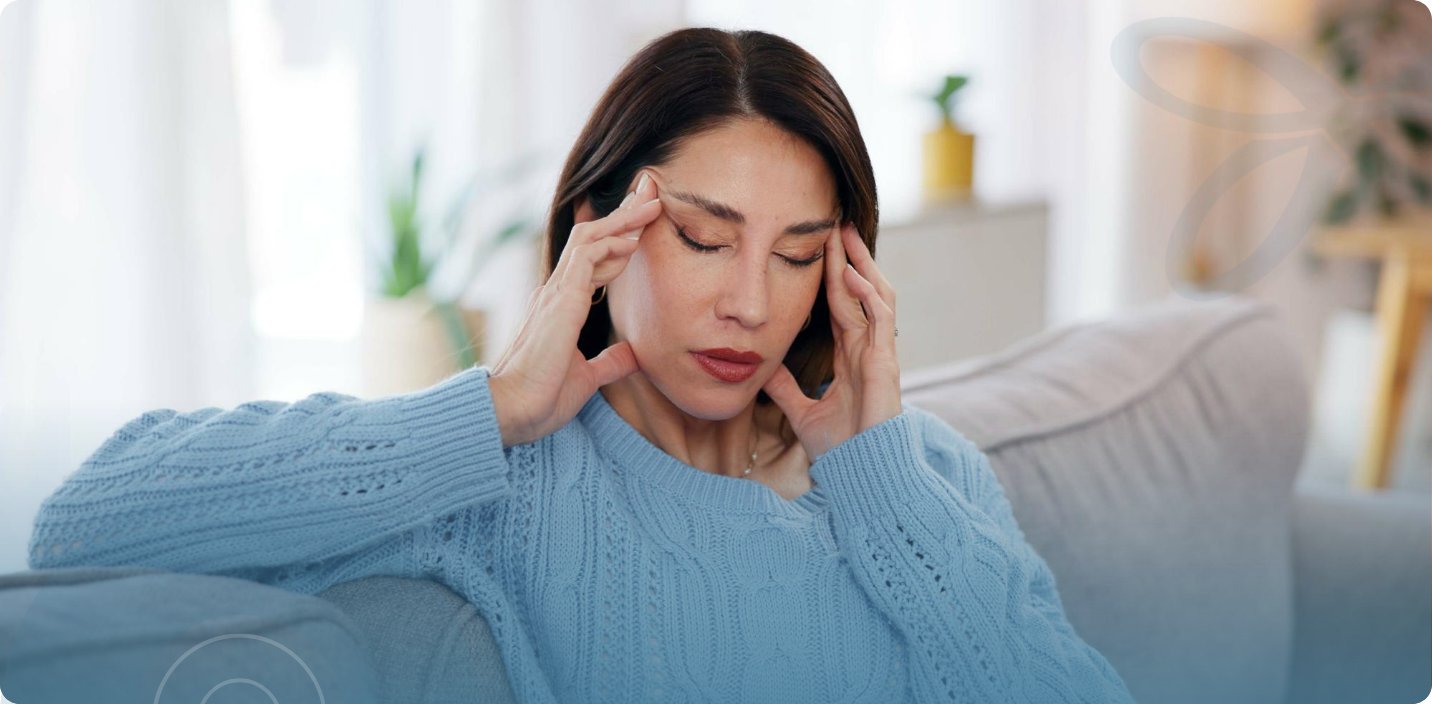 Midlife woman pausing to collect her thoughts, a moment that reflects the brain fog many women notice in perimenopause